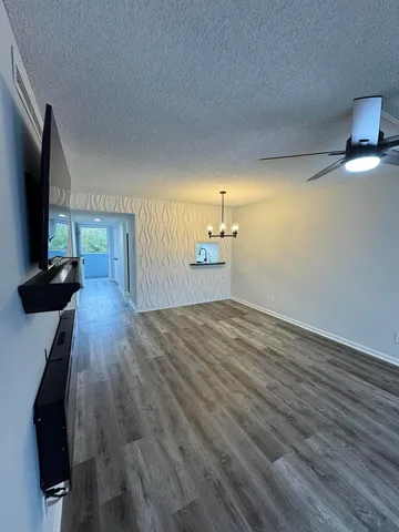 a view of a livingroom with wooden floor