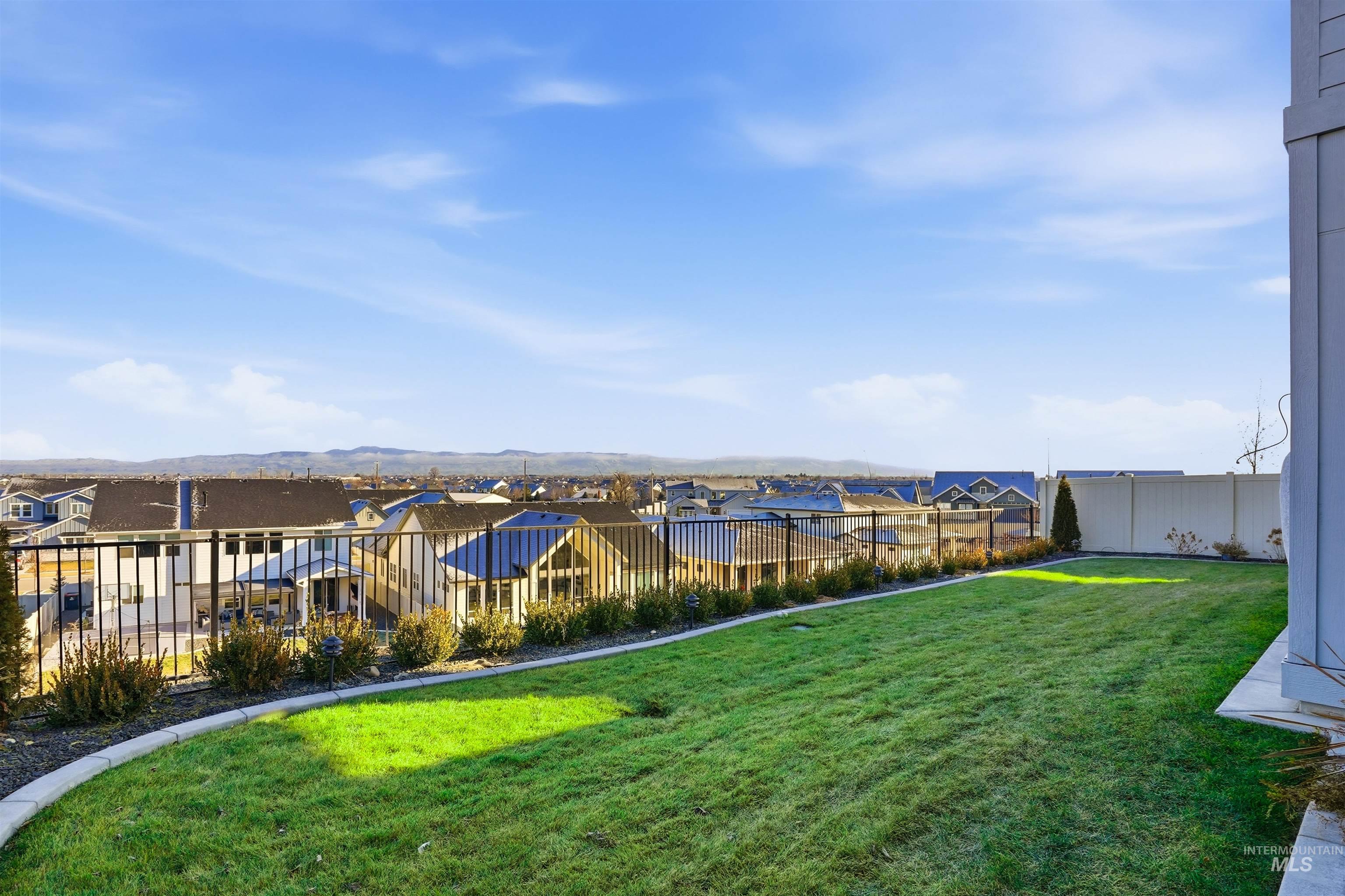 2976 East Parulo Drive Meridian, ID 83642 - Photo 37 of 40 Fenced yard with a residential view and a mountain view