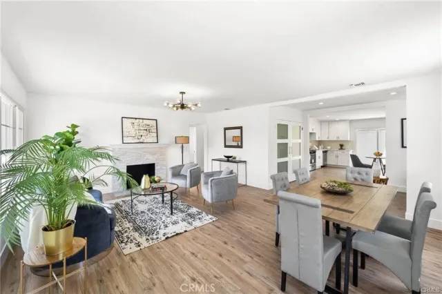 a dining room with furniture and wooden floor