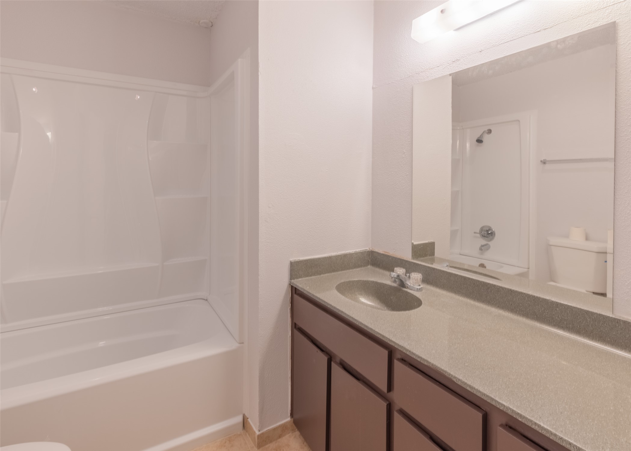 4600 Rocking Chair Road, Unit B Austin, TX 78744 - Photo 5 of 7 Bathroom with shower combination and vanity