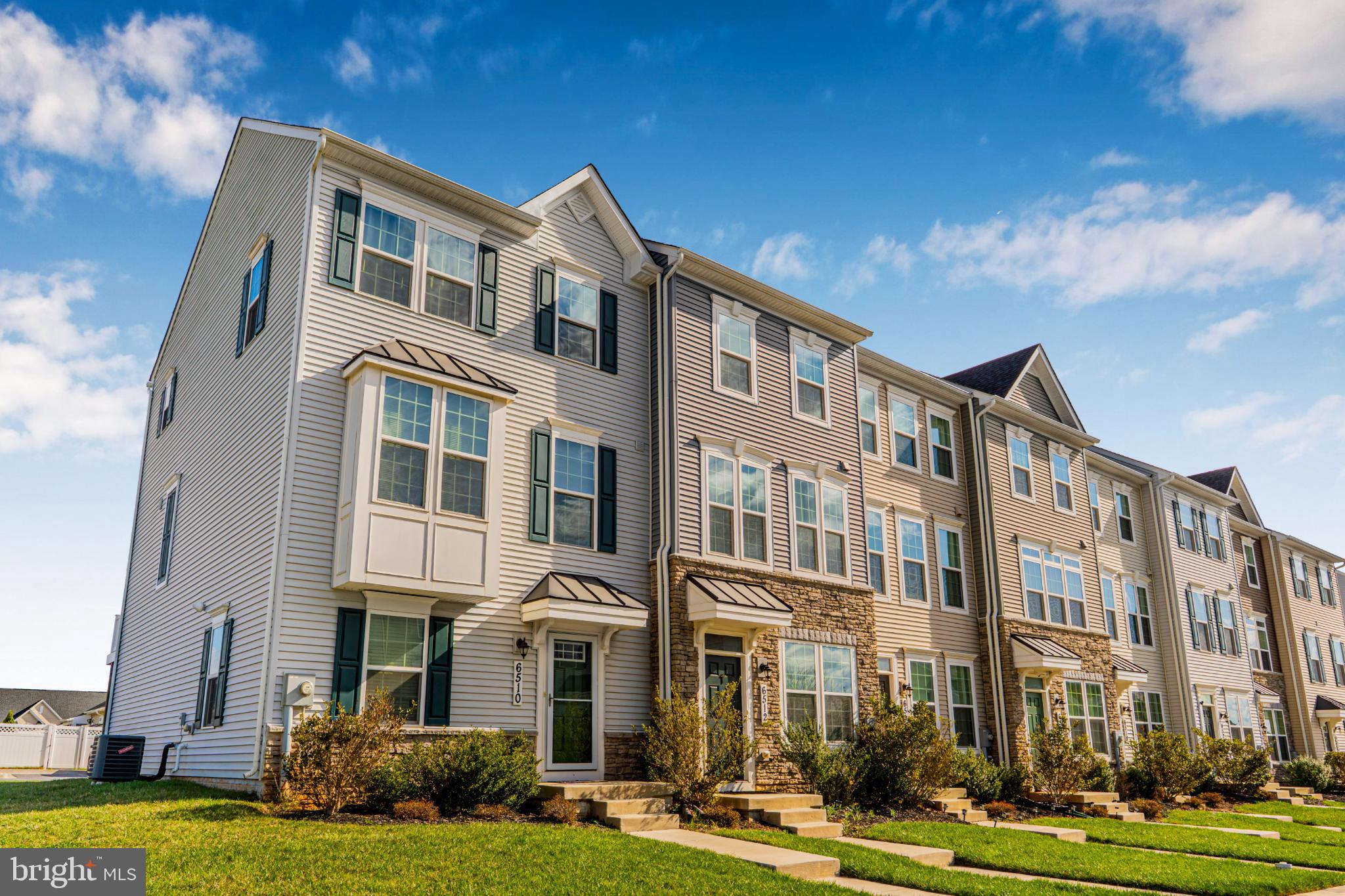 6510 Ballenger Run Boulevard Frederick, MD 21703 - Photo 14 of 18 a front view of a building with yard