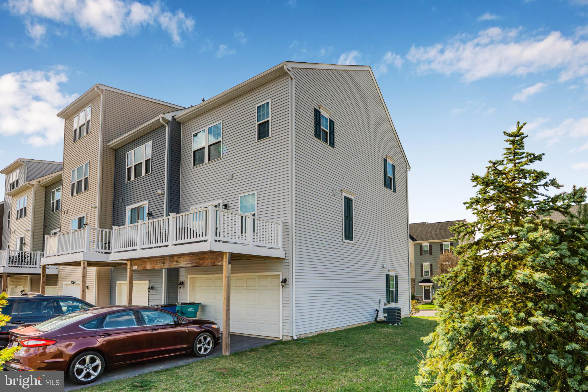 6510 Ballenger Run Boulevard Frederick, MD 21703 - Photo 15 of 18 a front view of a house with a garden