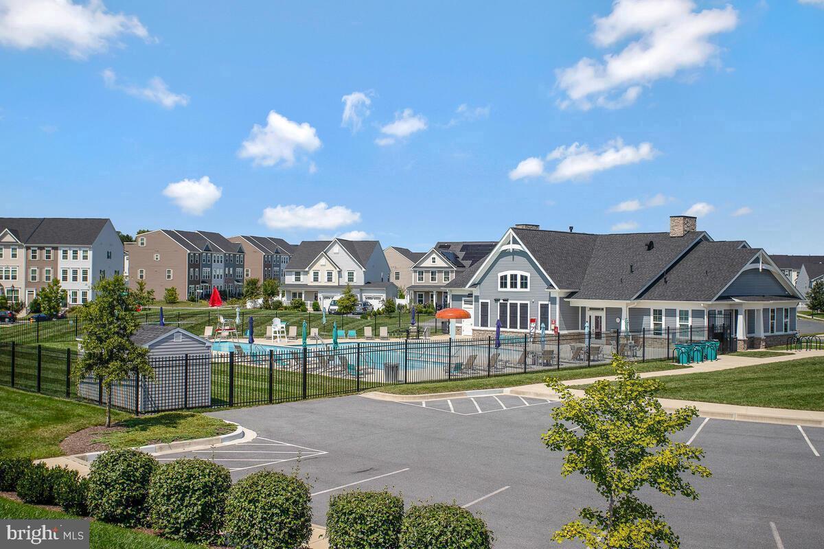 6510 Ballenger Run Boulevard Frederick, MD 21703 - Photo 17 of 18 a front view of a house with a garden