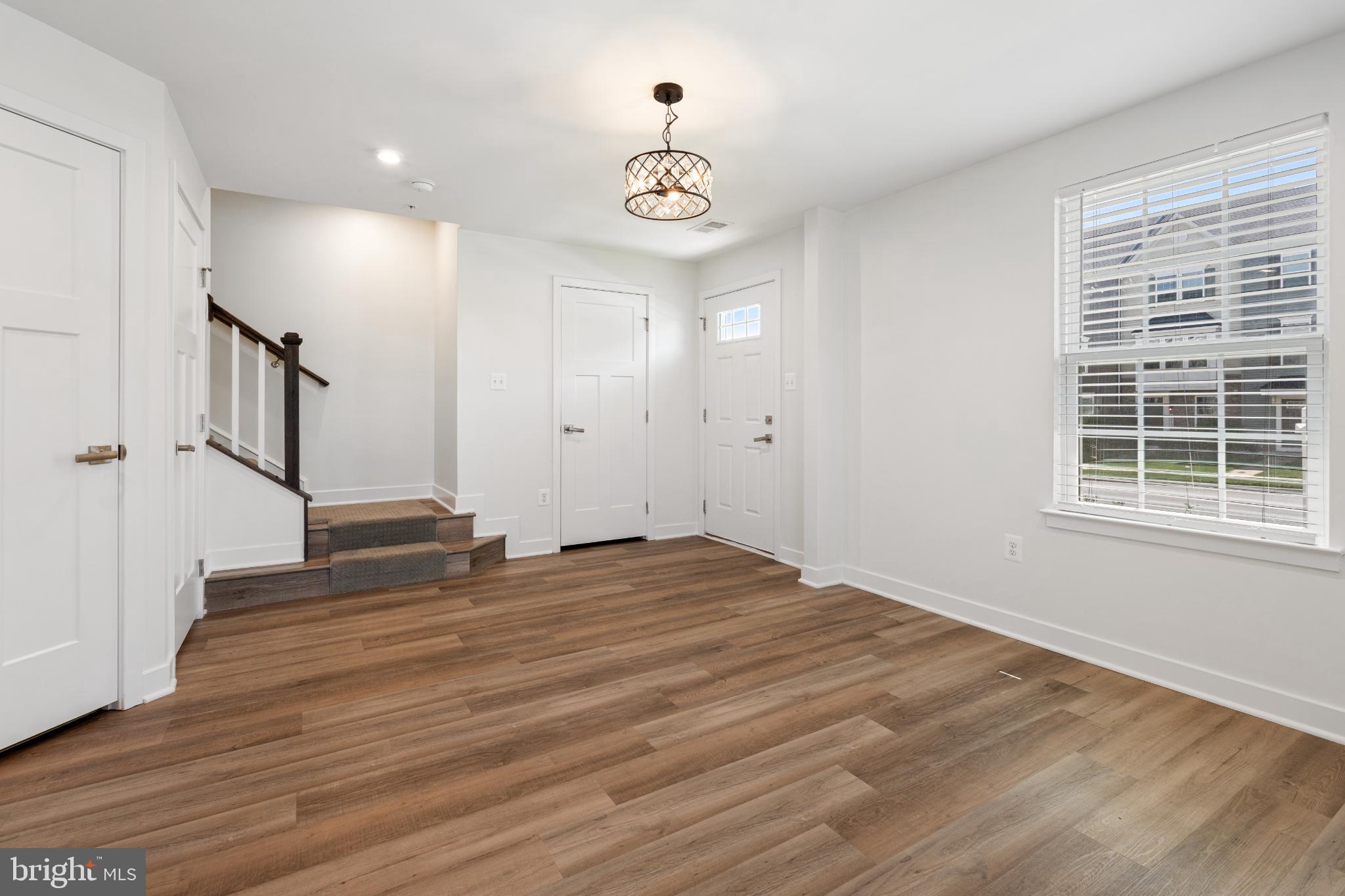 6510 Ballenger Run Boulevard Frederick, MD 21703 - Photo 2 of 18 a view of empty room with wooden floor and fan