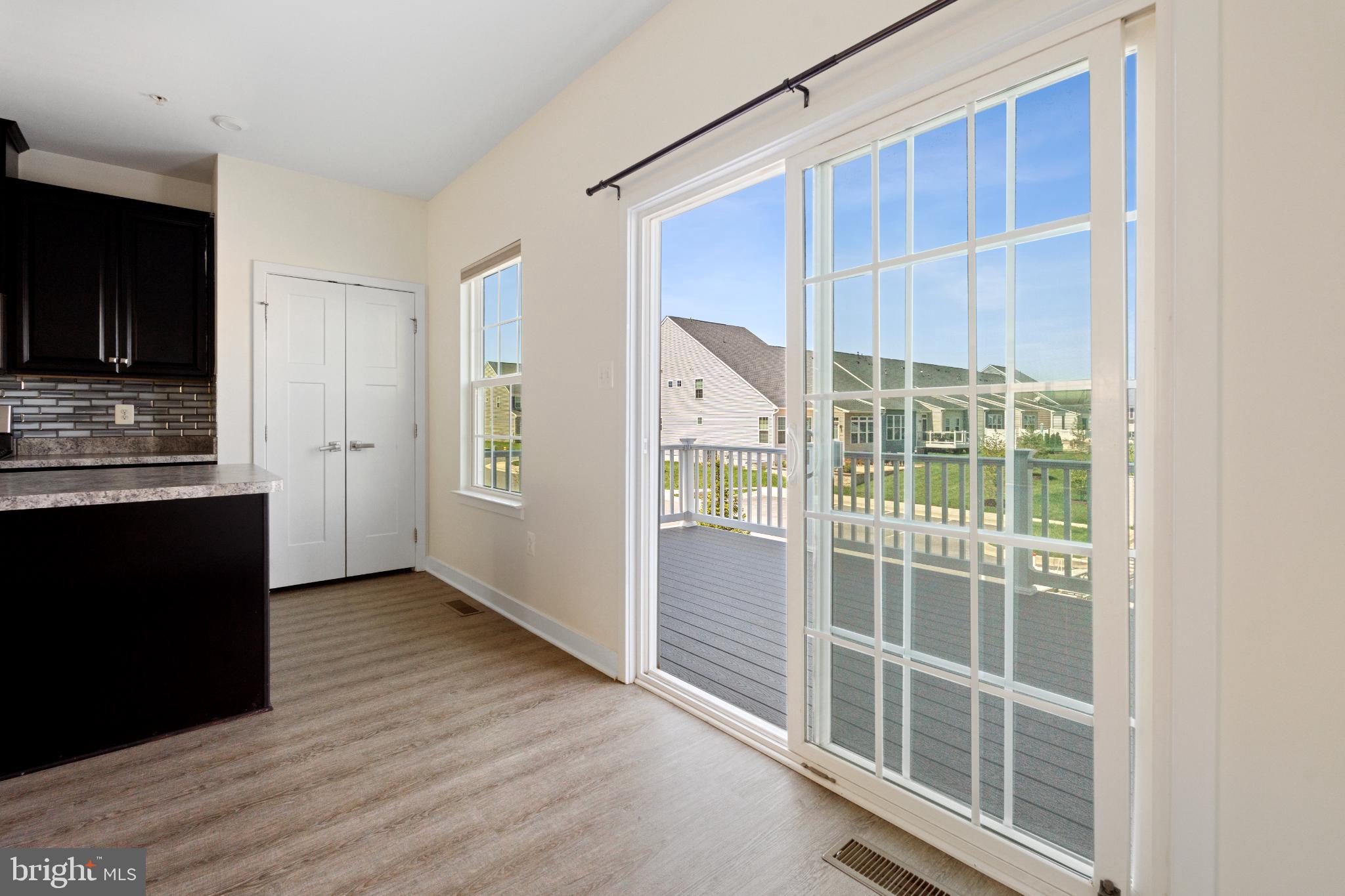 6510 Ballenger Run Boulevard Frederick, MD 21703 - Photo 7 of 18 a view of wooden floor and windows in a room