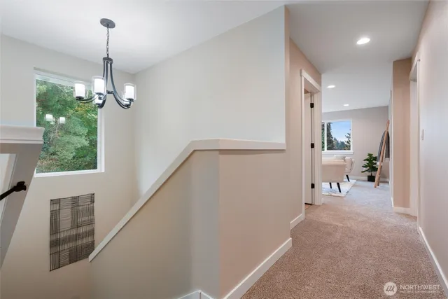 a very nice looking room with a large window and wooden floor