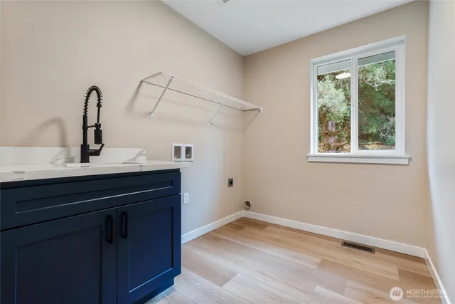 a kitchen with a sink and a window