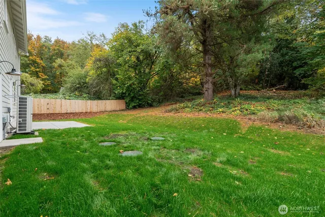 a backyard of a house with lots of green space