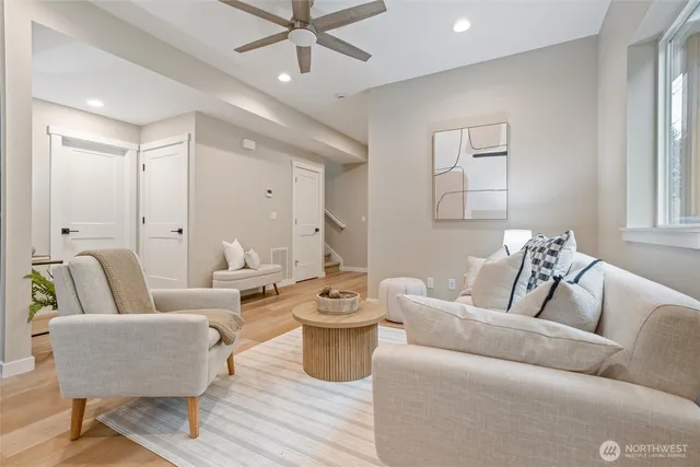 a living room with furniture and a large window