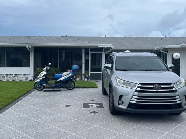 a view of a patio with table and chairs with wooden fence