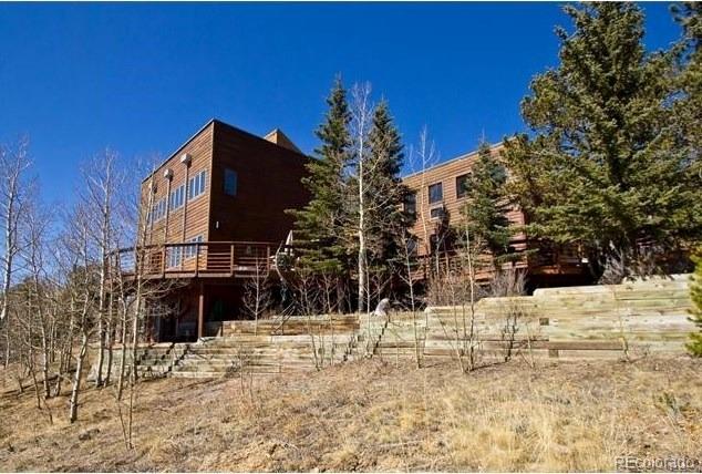 a view of a house with snow on the road