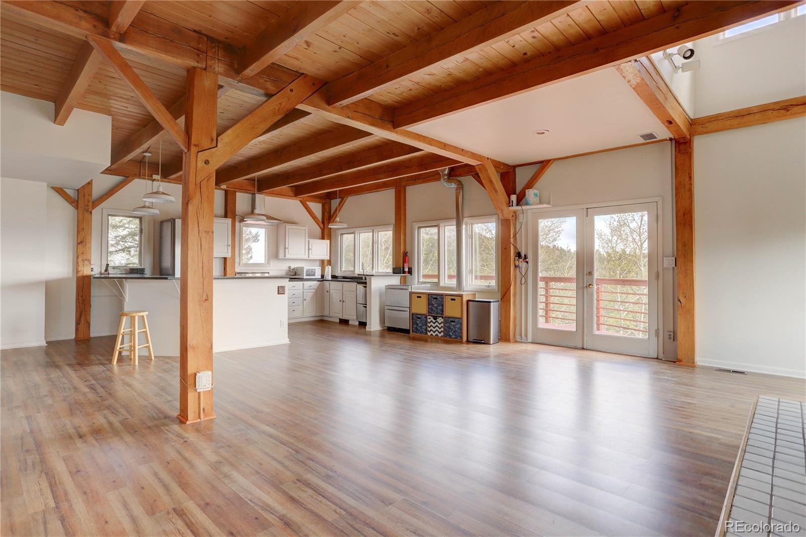 400 Alpine Way Idaho Springs, CO 80452 - Photo 11 of 40 a view of a livingroom with wooden floor