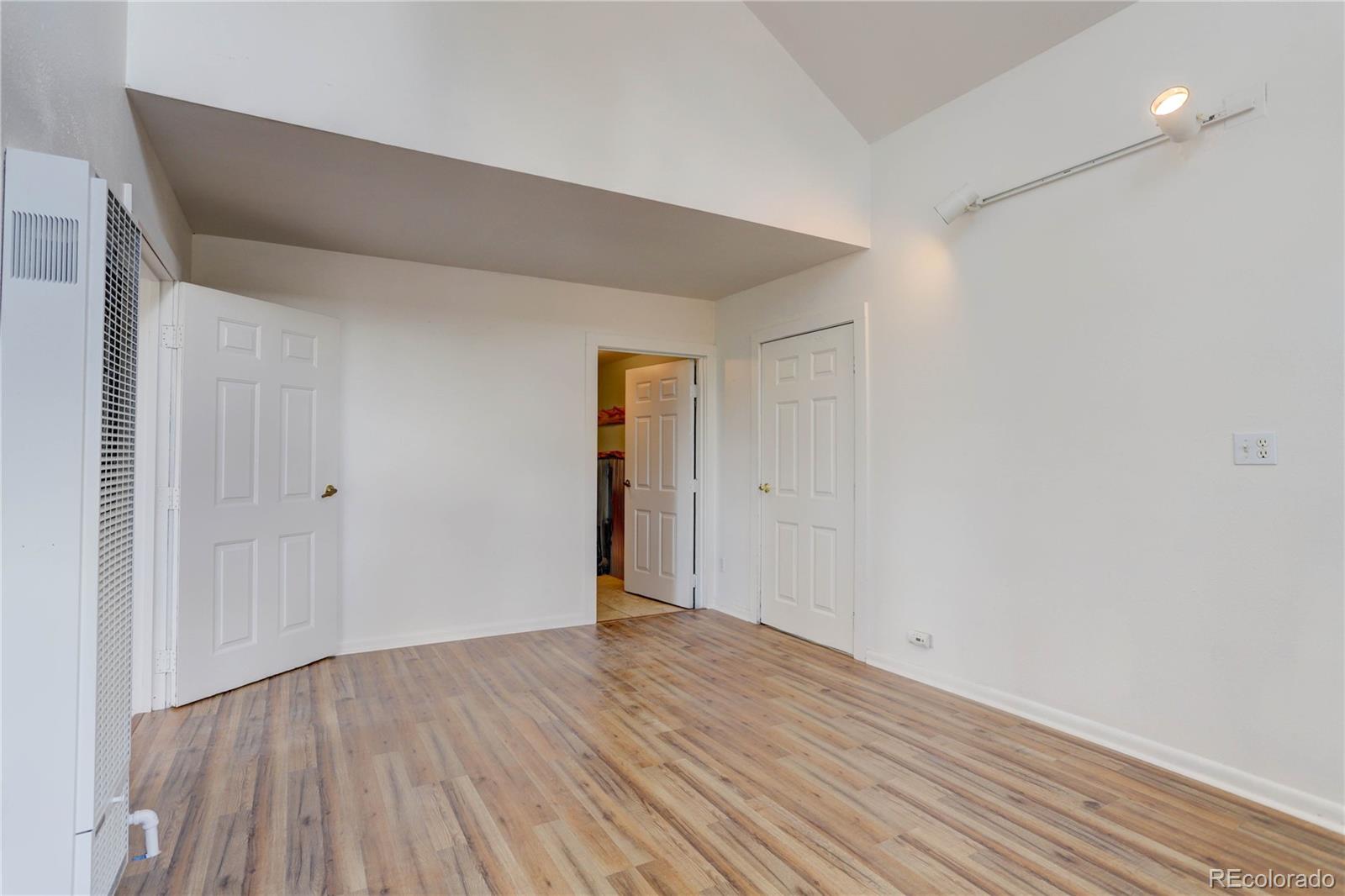 400 Alpine Way Idaho Springs, CO 80452 - Photo 13 of 40 a view of an empty room with wooden floor and closet