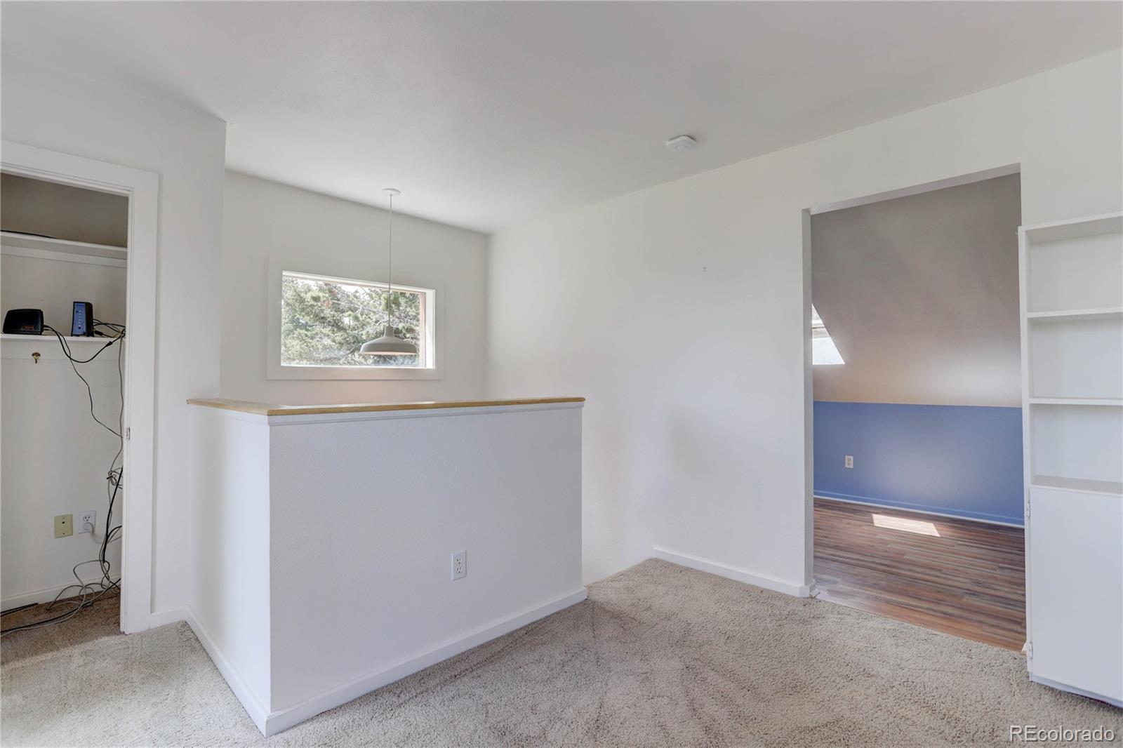 400 Alpine Way Idaho Springs, CO 80452 - Photo 18 of 40 a view of an empty room with closet and a window