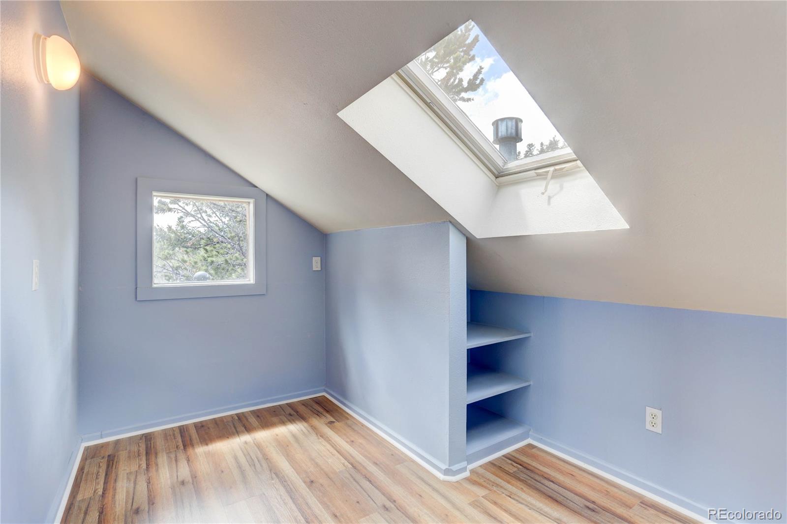 400 Alpine Way Idaho Springs, CO 80452 - Photo 19 of 40 an empty room with windows