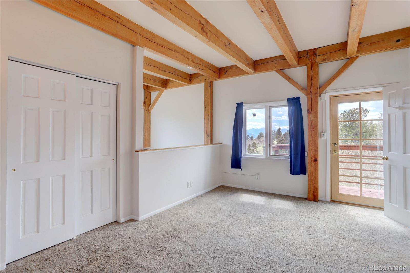 400 Alpine Way Idaho Springs, CO 80452 - Photo 25 of 40 an empty room with windows