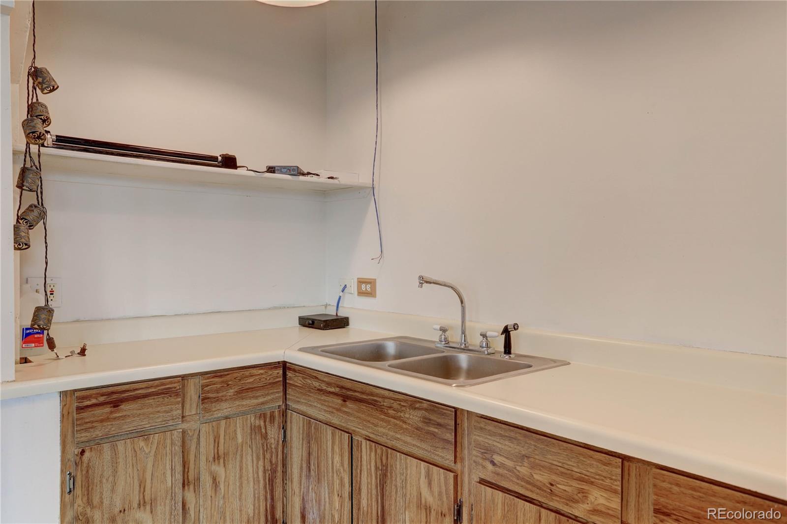 400 Alpine Way Idaho Springs, CO 80452 - Photo 31 of 40 a bathroom with a sink and a mirror
