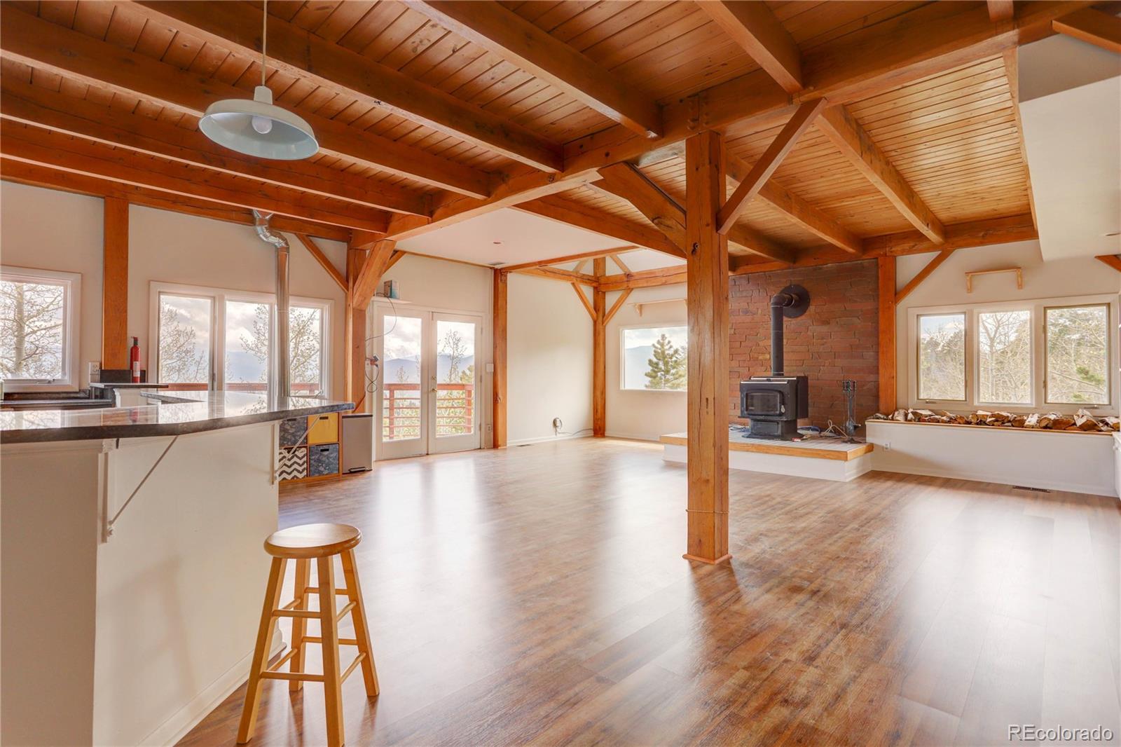 400 Alpine Way Idaho Springs, CO 80452 - Photo 10 of 40 a view of a hall with wooden floor