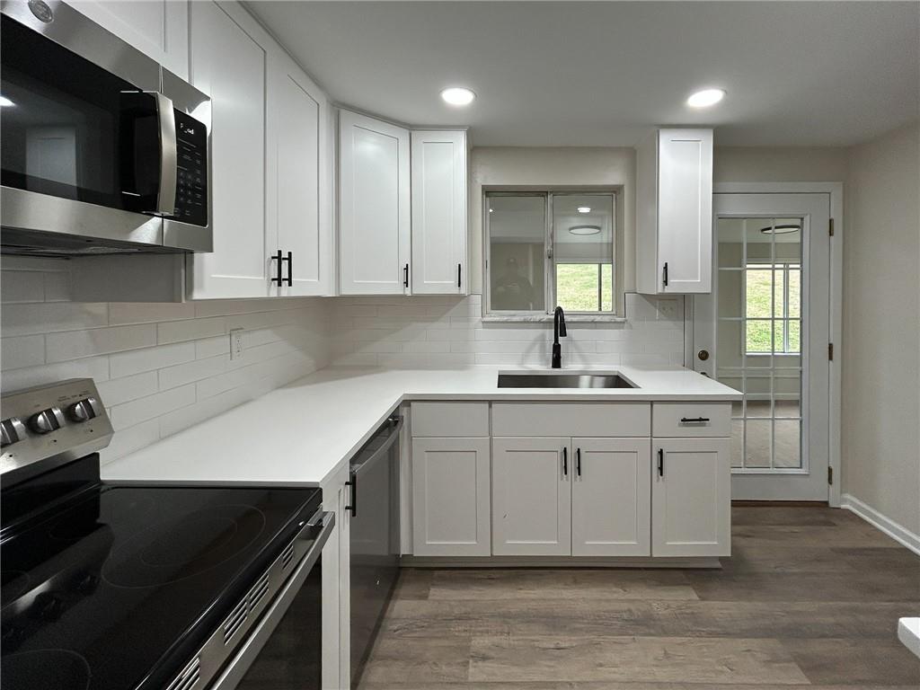 389 Rural Valley Road Claysville, PA 15323 - Photo 13 of 14 a kitchen with a sink cabinets and microwave