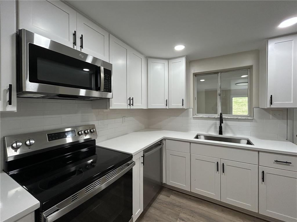 389 Rural Valley Road Claysville, PA 15323 - Photo 14 of 14 a kitchen with a sink and cabinets