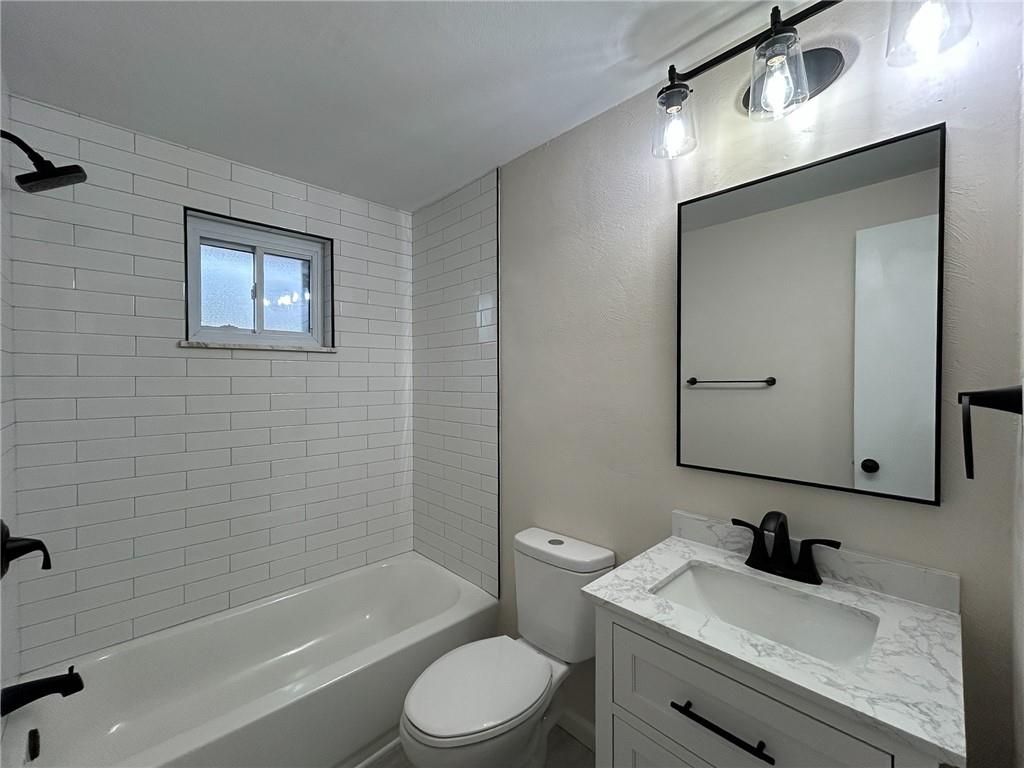 389 Rural Valley Road Claysville, PA 15323 - Photo 16 of 35 a bathroom with a granite countertop toilet sink and mirror