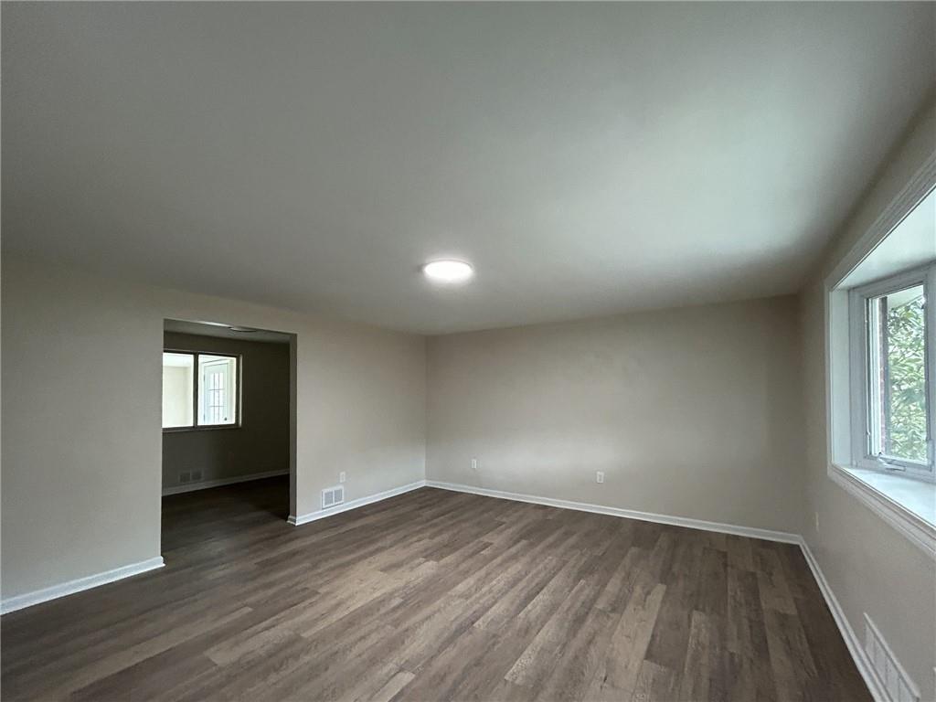 389 Rural Valley Road Claysville, PA 15323 - Photo 7 of 14 an empty room with wooden floor and windows