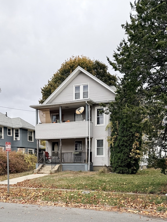 20 Clark Street, Unit 1 Framingham, MA 01702 - Photo 17 of 17 a front view of a house with a yard