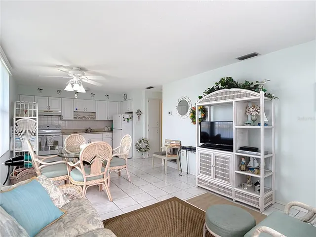 a view of a livingroom with furniture and white furniture