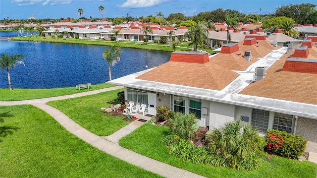 an aerial view of a house with a lake view