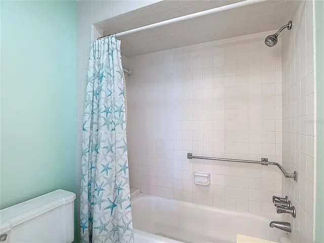 a view of hallway with stairs and wooden floor