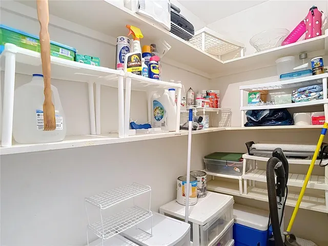 a view of a lake with houses in the back