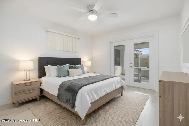 a bedroom with bed and a night stand