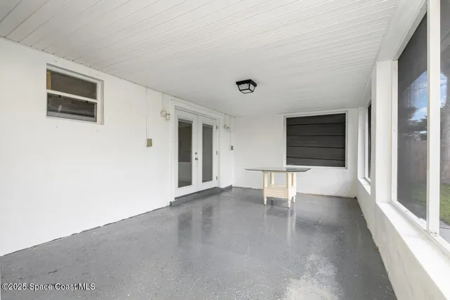 a view of a livingroom with an empty space and wooden floor