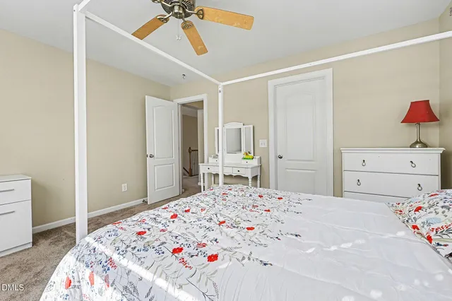 a spacious bathroom with a granite countertop double vanity sink mirror and
