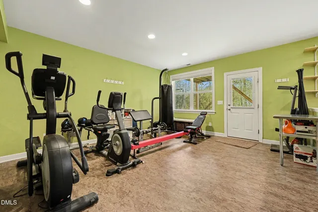 a view of backyard with barbeque grill and outdoor seating