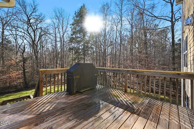 a swimming pool with outdoor seating and yard