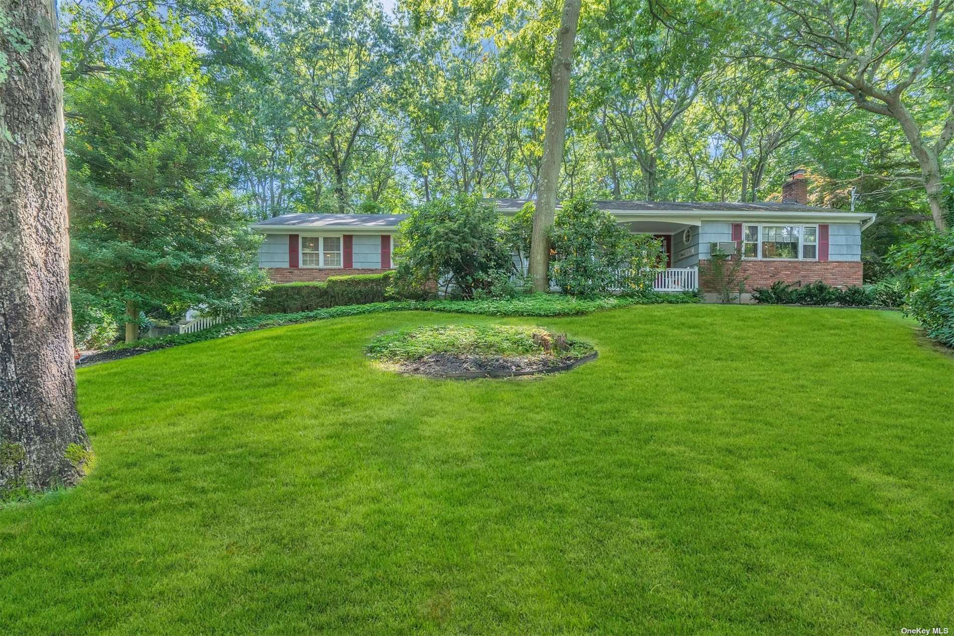 190 Lower Sheep Pasture Road Setauket, NY 11733 - Photo 1 of 1 a front view of a house with a garden