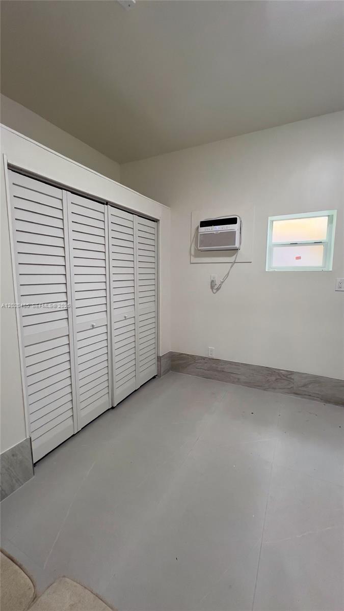 1845 Bay Road, Unit 1 Miami Beach, FL 33139 - Photo 4 of 9 an empty room with windows