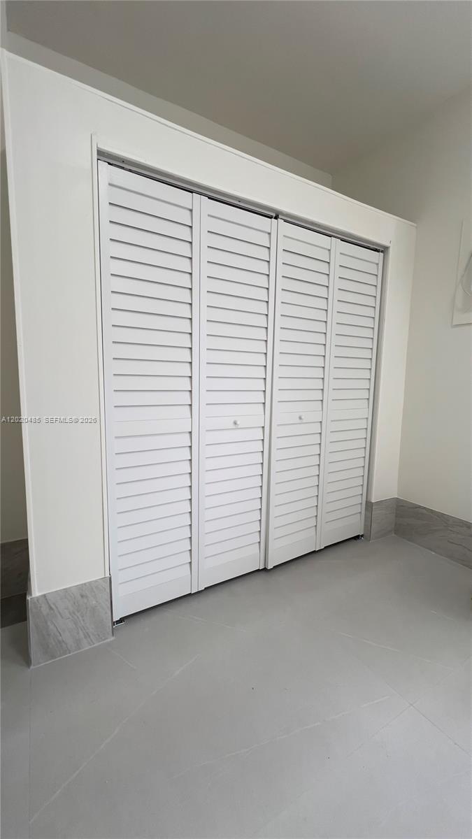 1845 Bay Road, Unit 1 Miami Beach, FL 33139 - Photo 5 of 9 an empty room with a door
