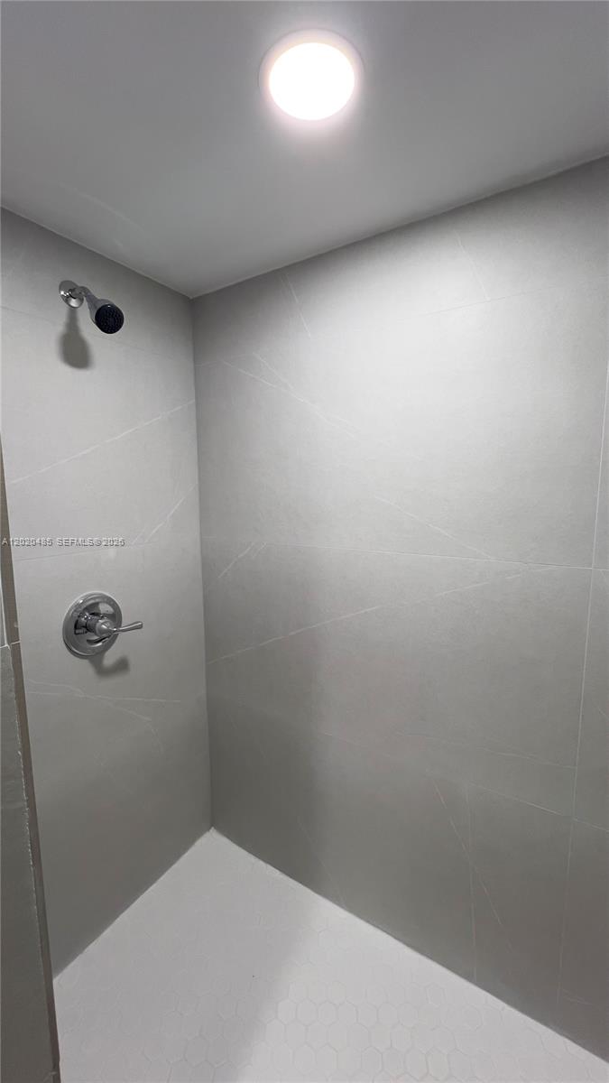 1845 Bay Road, Unit 1 Miami Beach, FL 33139 - Photo 8 of 9 a bathroom with a toilet and a shower