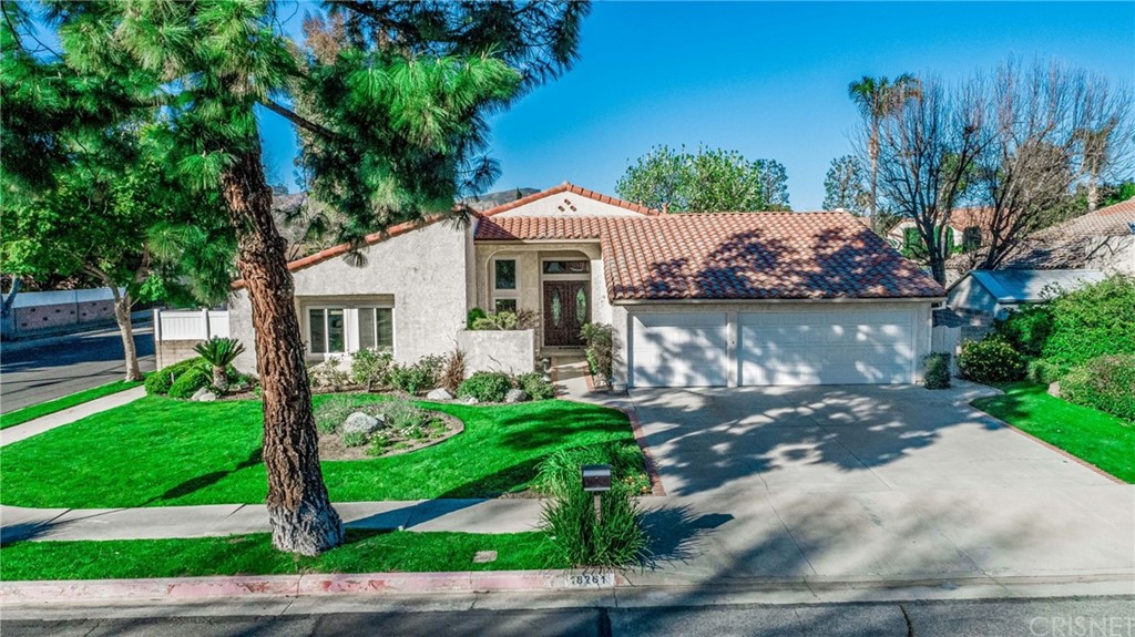 18261 Hiawatha Street Northridge, CA 91326 - Photo 1 of 35 a front view of a house with garden