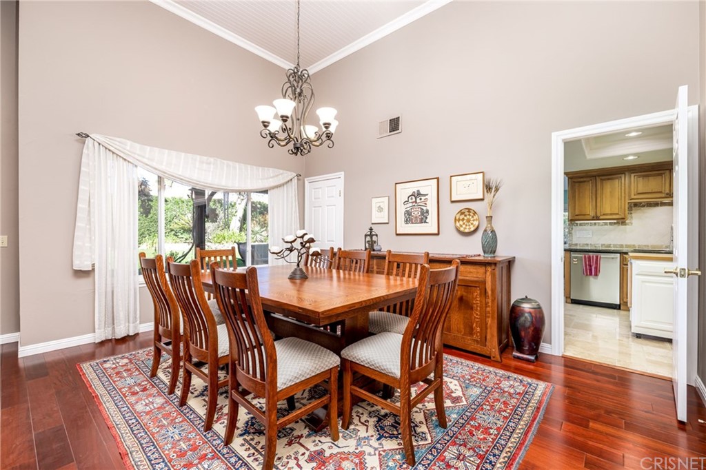 18261 Hiawatha Street Northridge, CA 91326 - Photo 14 of 35 a view of a dining room with furniture wooden floor and chandelier