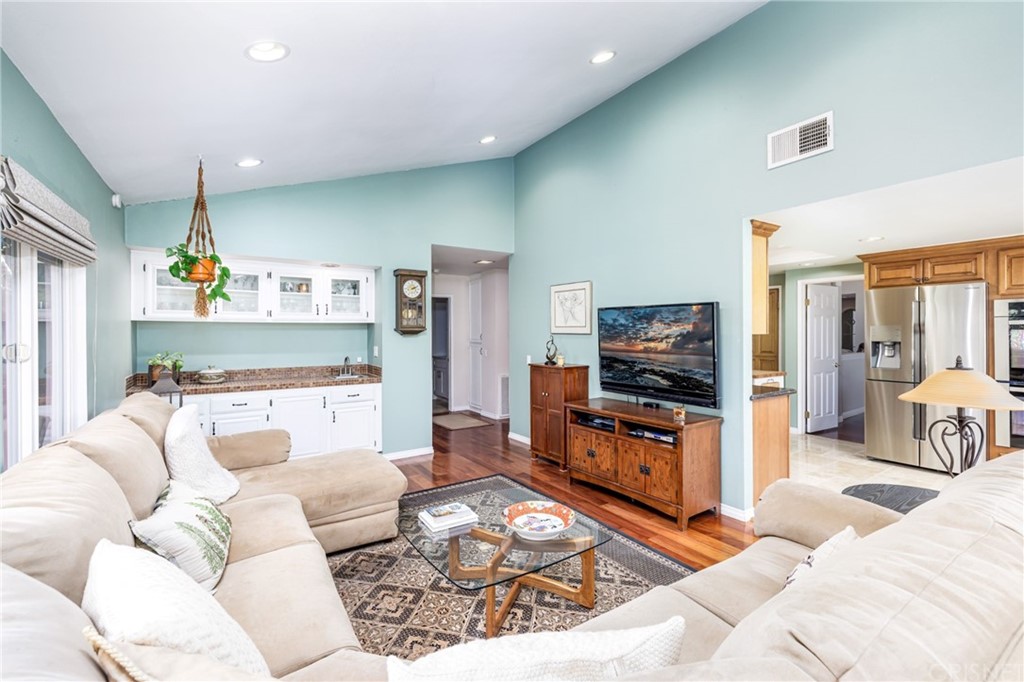 18261 Hiawatha Street Northridge, CA 91326 - Photo 20 of 35 a living room with furniture and a flat screen tv