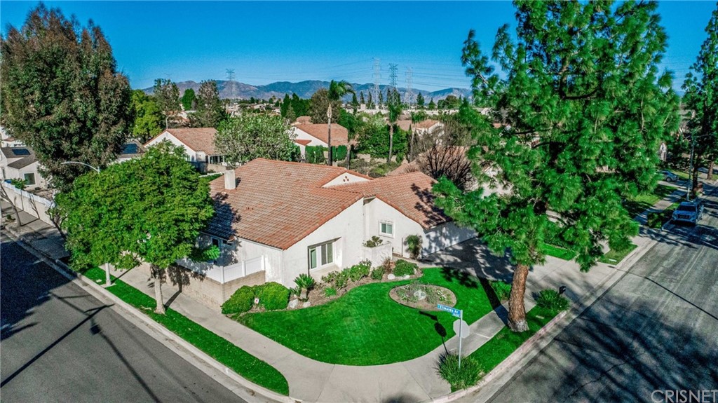 18261 Hiawatha Street Northridge, CA 91326 - Photo 2 of 35 a view of a house with a yard and potted plants