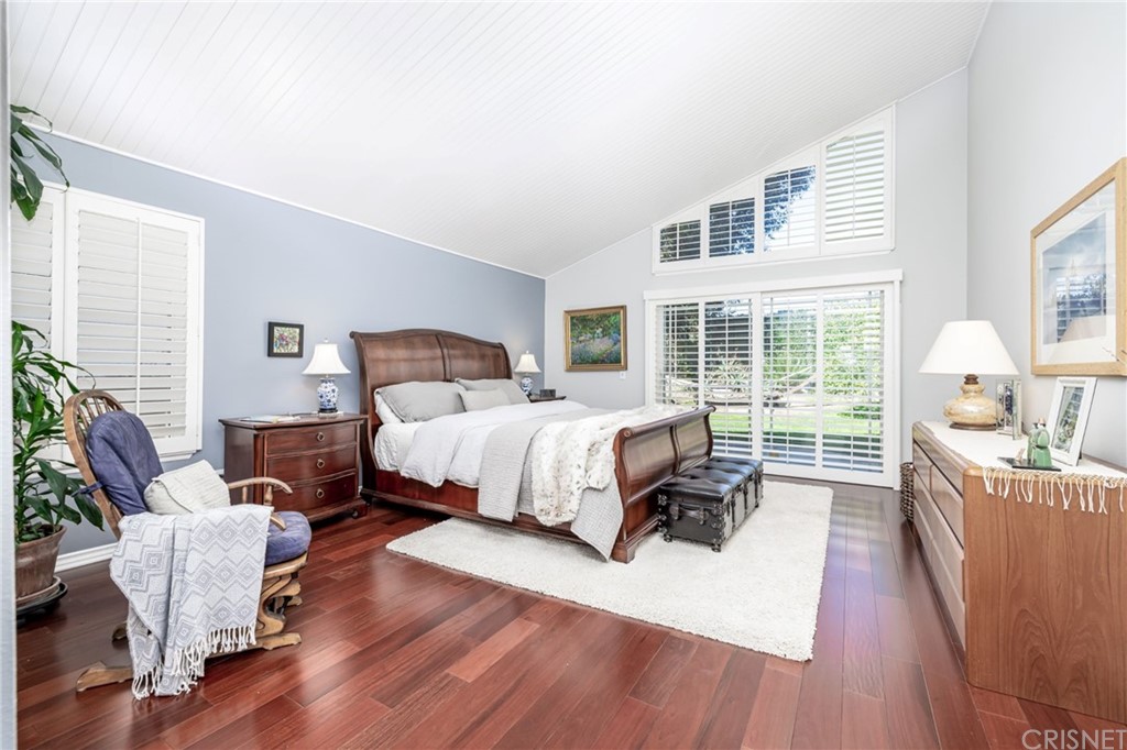 18261 Hiawatha Street Northridge, CA 91326 - Photo 25 of 35 a bedroom with a bed and wooden floor