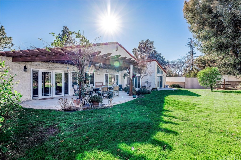 18261 Hiawatha Street Northridge, CA 91326 - Photo 32 of 35 a view of a house with a yard porch and sitting area