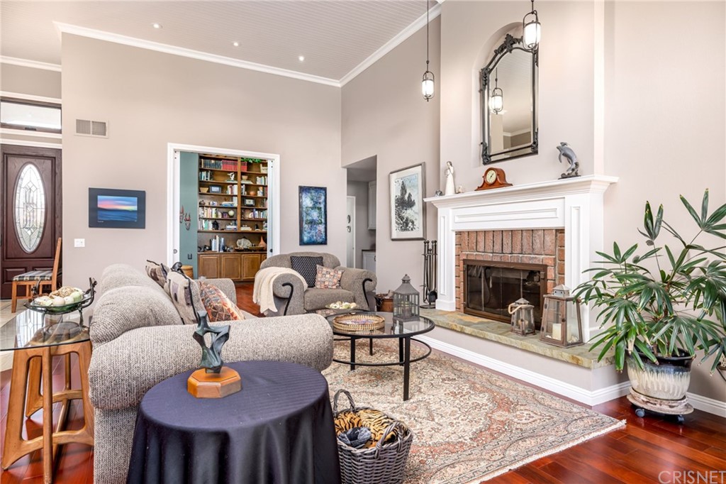 18261 Hiawatha Street Northridge, CA 91326 - Photo 7 of 35 a living room with furniture and a fireplace