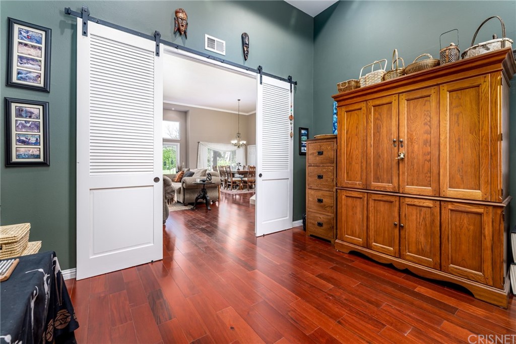 18261 Hiawatha Street Northridge, CA 91326 - Photo 8 of 35 a view of a livingroom with wooden floor