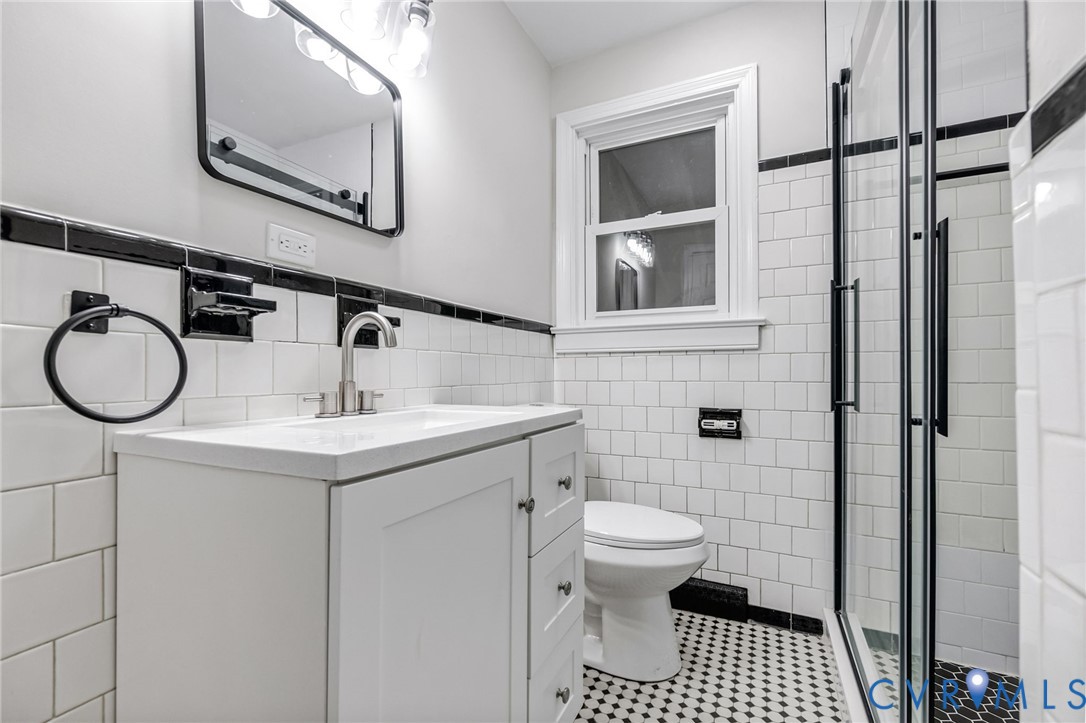 5317 River Road Petersburg, VA 23803 - Photo 11 of 19 White vanity with an integrated sink, brushed nick