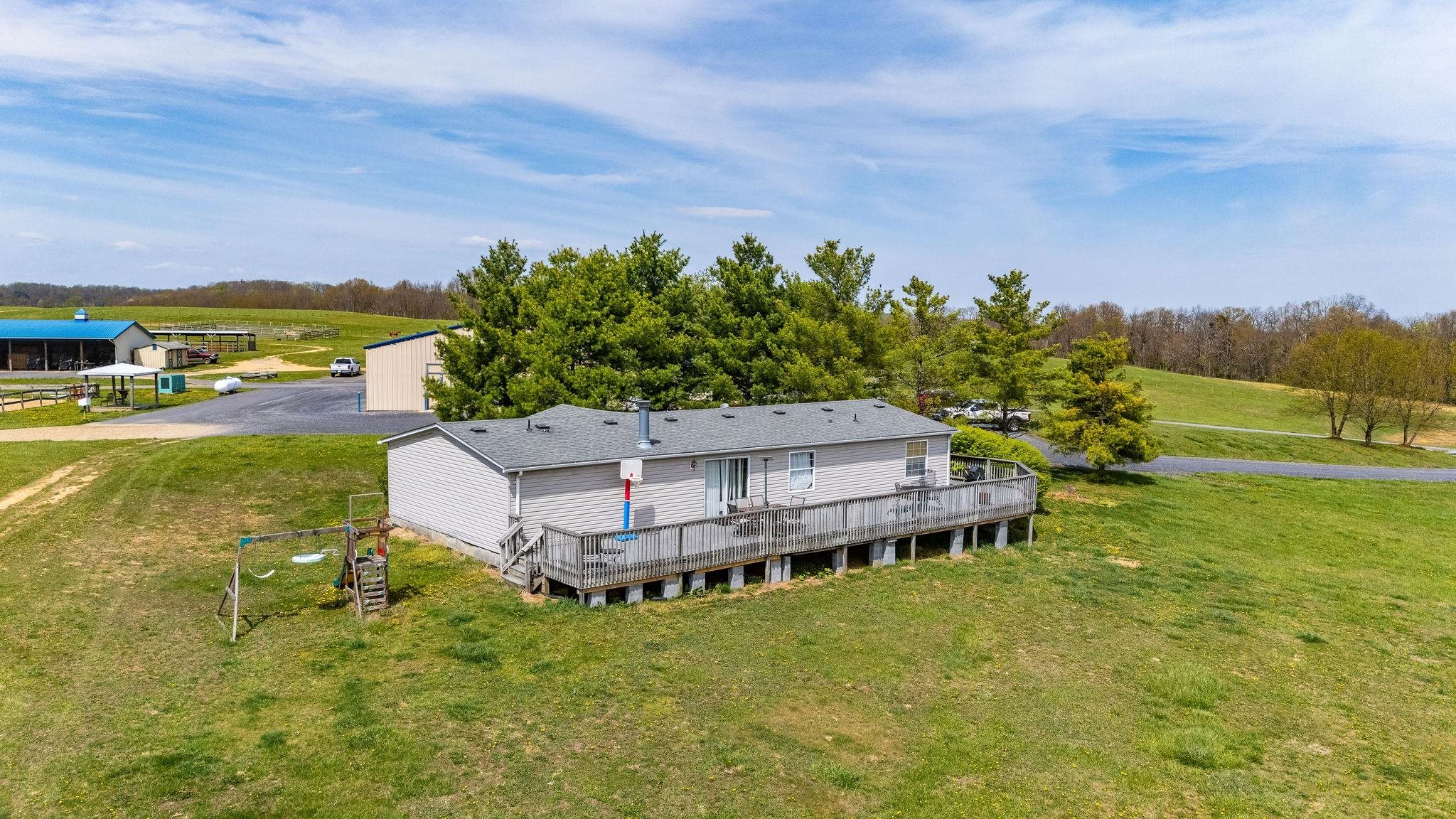 309 Old B&O Road Raphine, VA 24472 - Photo 33 of 75 a view of a swimming pool with an ocean and trees in the background